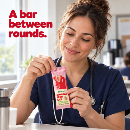 Crunchy Fruit Bar Strawberry — nurse holding the wrapped bar on a break