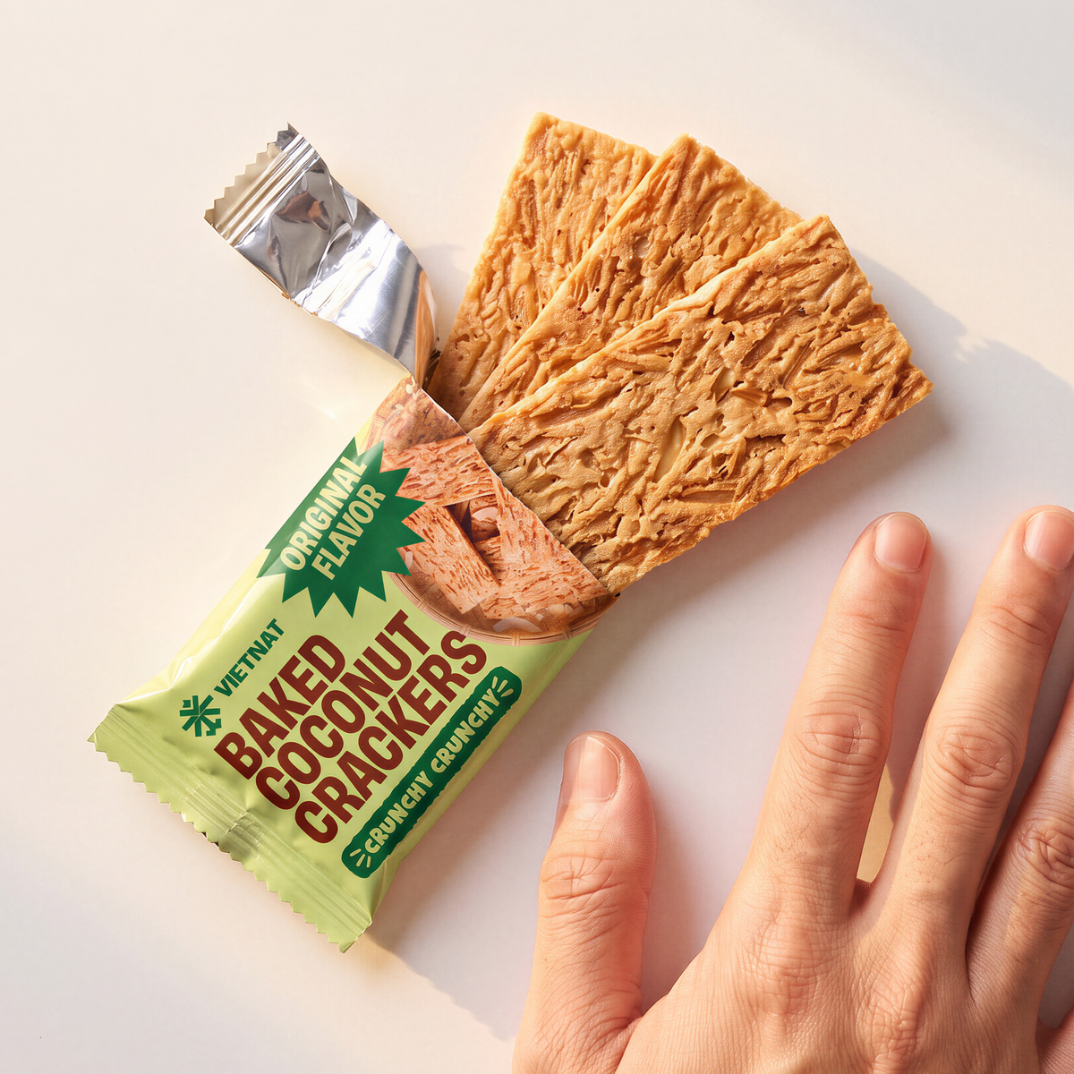 One snack pack and crackers shown next to a hand for size, Original