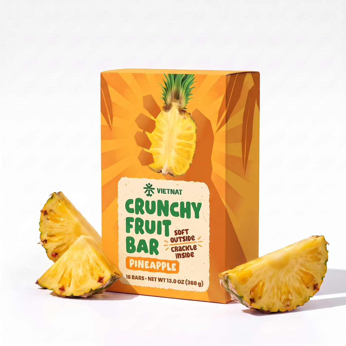 Crunchy Fruit Bar Pineapple box of 16 bars next to fresh pineapple