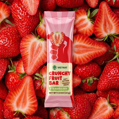 Crunchy Fruit Bar Strawberry wrapper on a pile of fresh strawberries