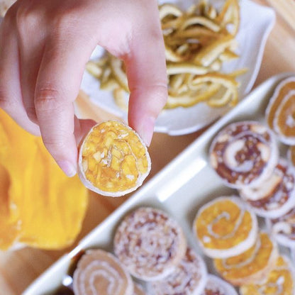 A real VietNat mango roll in hand: crisp rice-paper rim, chewy mango center