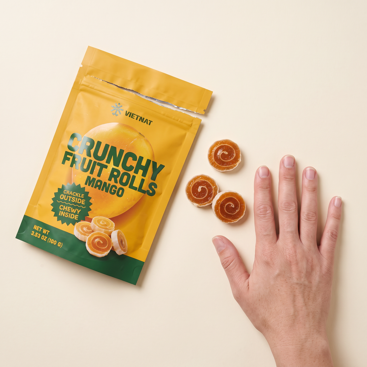 VietNat mango rolls next to a hand for size, about 1¼ in across