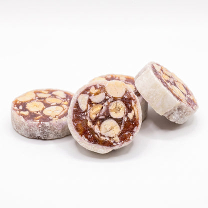 Crispy banana peanut fruit rolls showing peanut pieces and sesame