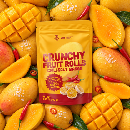 VietNat Crunchy Chili-Salt Mango Fruit Rolls bag among ripe mangoes and red chilies